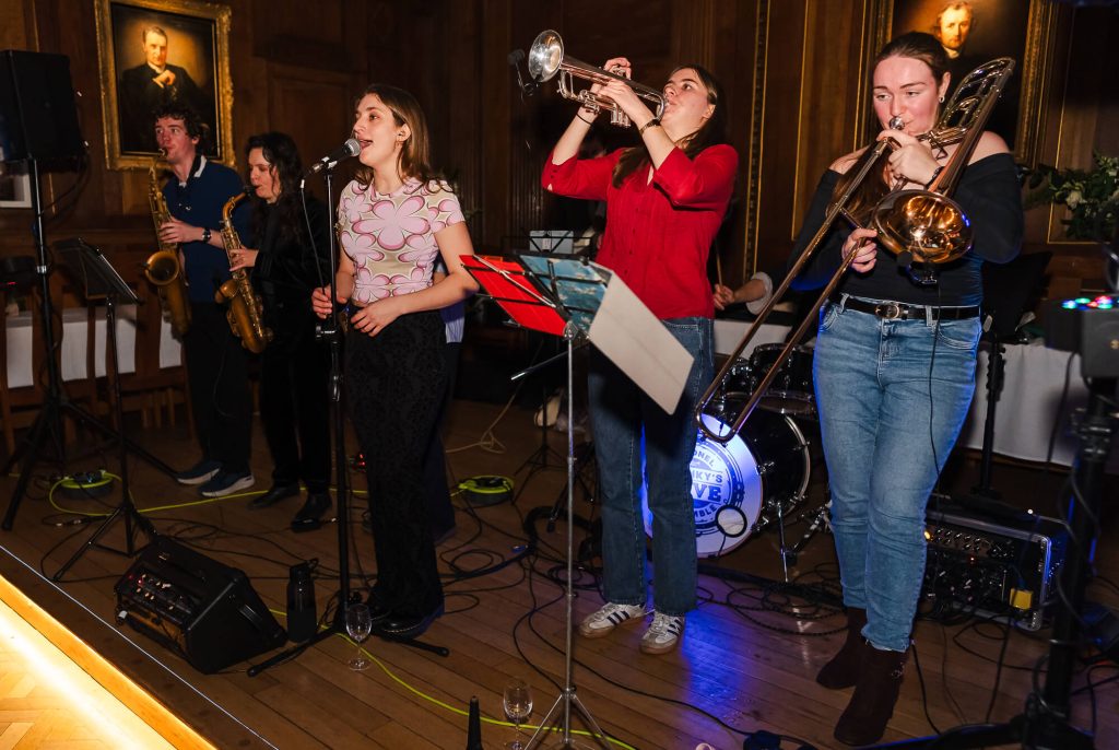 Band playing at Selwyn College, Cambridge wedding photography